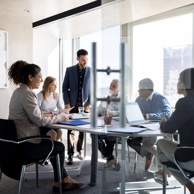 Business executives working in office together.