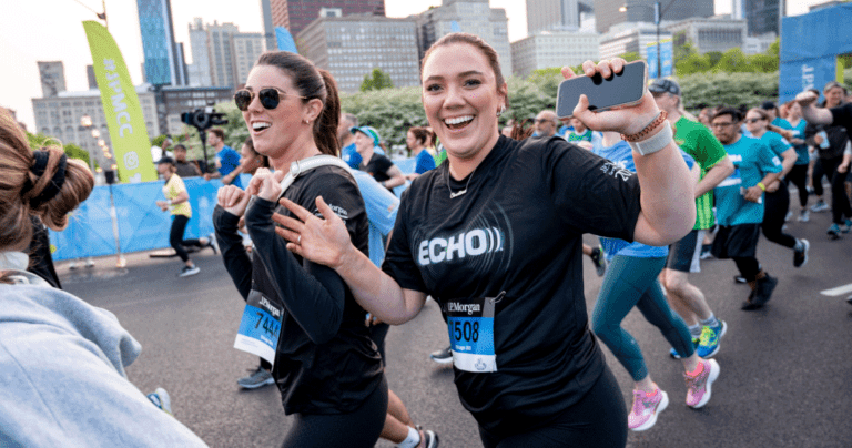 Two Echo employees participating in running for the Chase Corporate Challenge 5k.