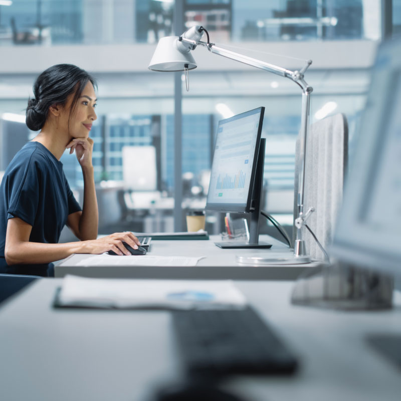 Female employee working on desktop.