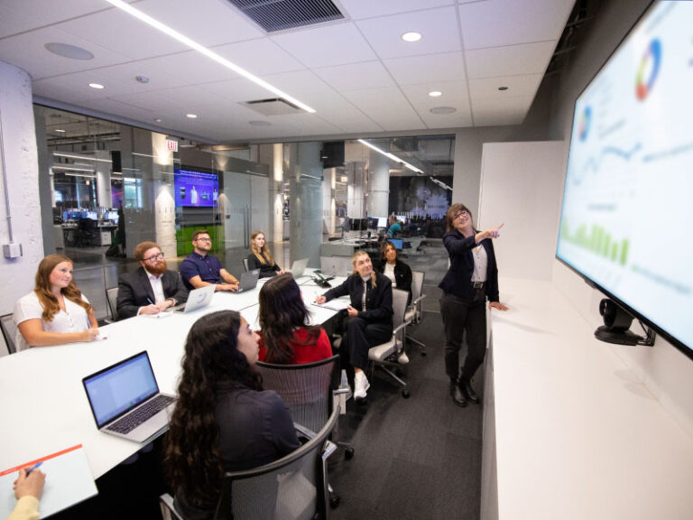 Echo employees engaging in a tech focused meeting.