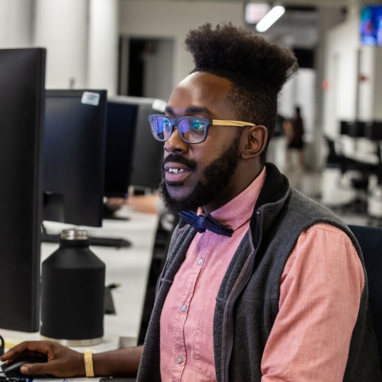 An Echo employee on their computer at Echo's Chicago office.