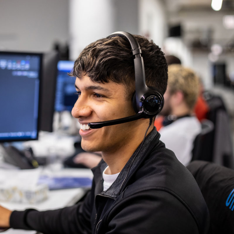 An Echo employee on the phone with a client helping them book their next shipment.