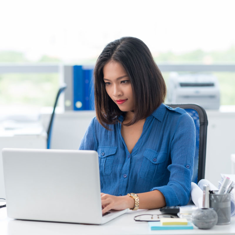 Shipper tracking shipments in her office.