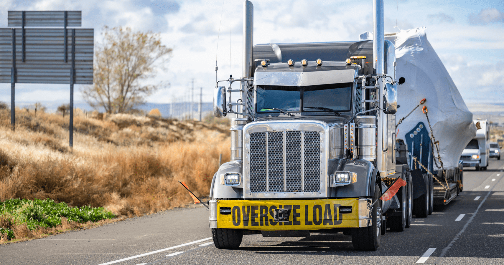 A heavy haul truck going down the highway.