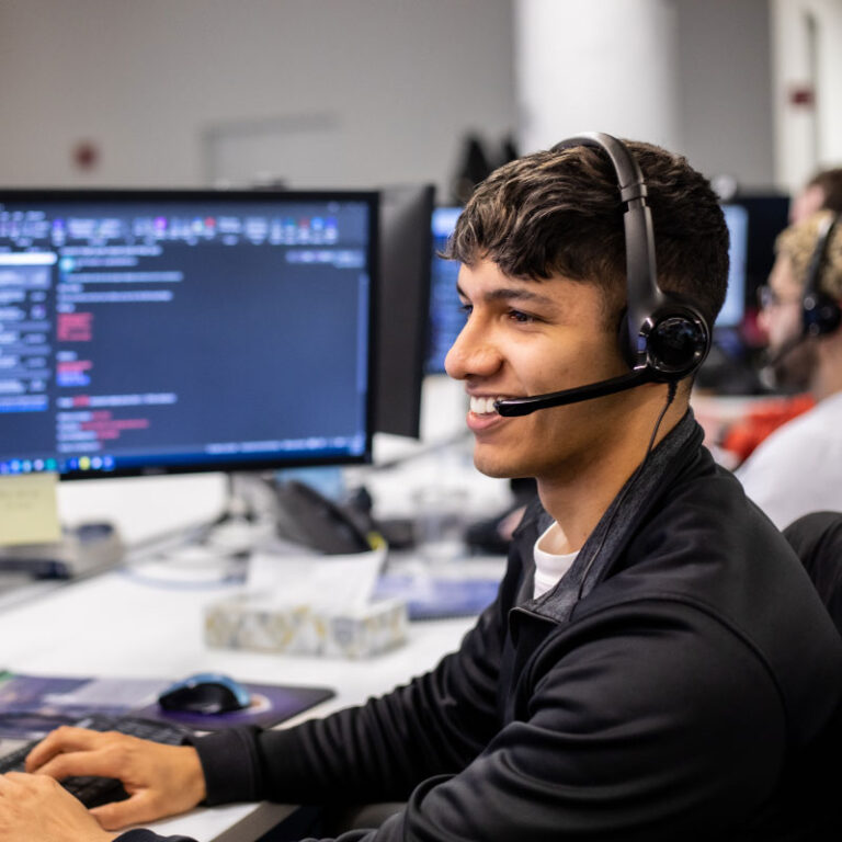 An Echo employee at their computer answering calls from clients.