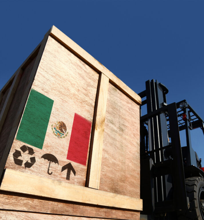 A wooden crate with the Mexican flag imprinted on the back.
