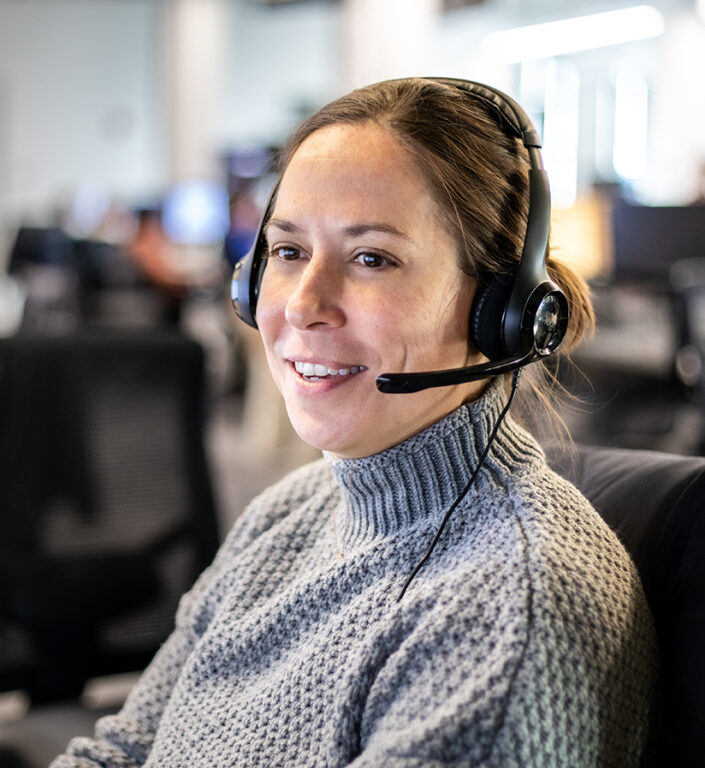 An Echo sales representative answering phone calls on their headset at their workstation. 