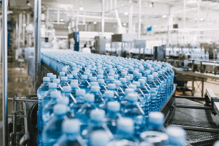 Workers in a temperature controlled warehouse checking on food grade products.