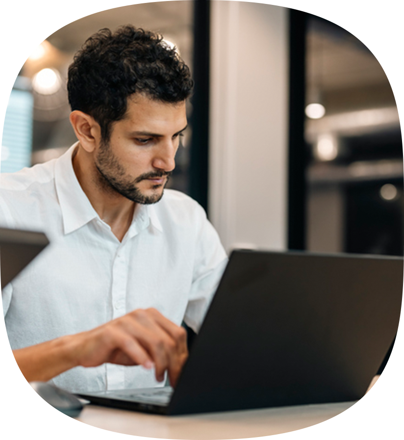 A client on their laptop at the office shipping their retail products.