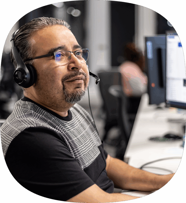 An Echo team member at their work station helping a client optimize their manufacturing supply chain.