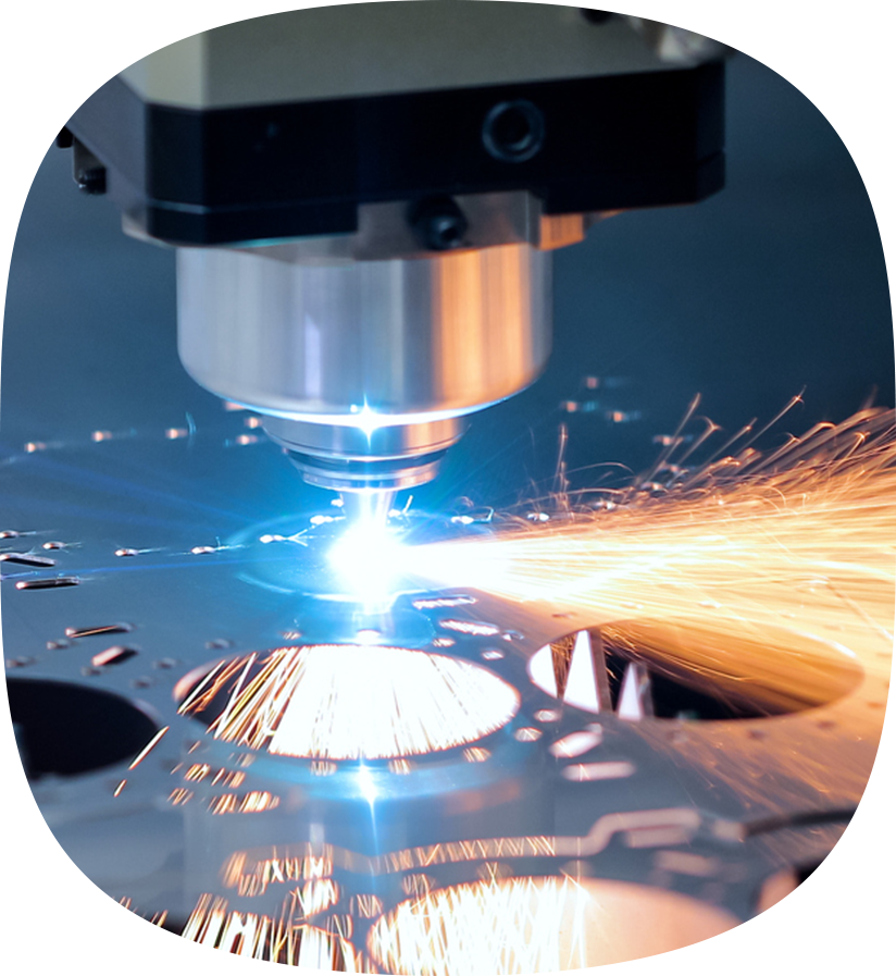 A drilling machine cutting out circles in a metal plate.