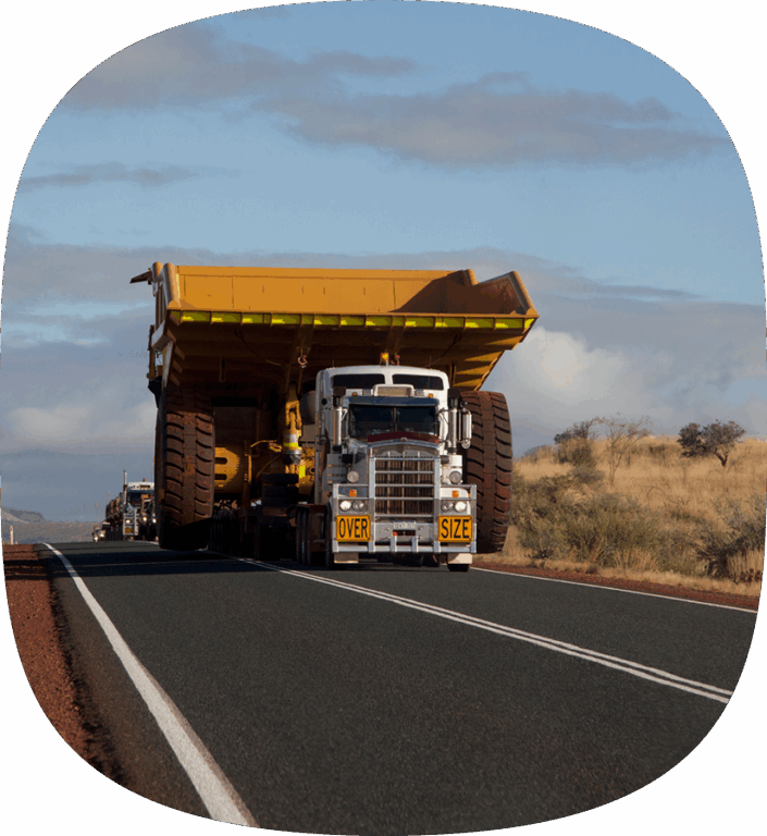 A specialized semi truck delivering an oversized shipment for a manufacturer. 