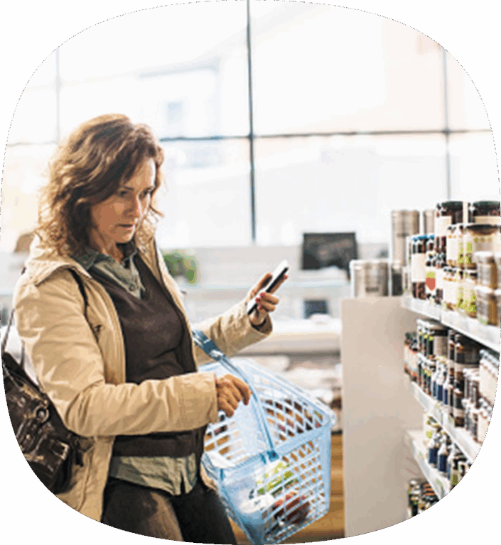 A person shopping for their CPG at a grocery store.