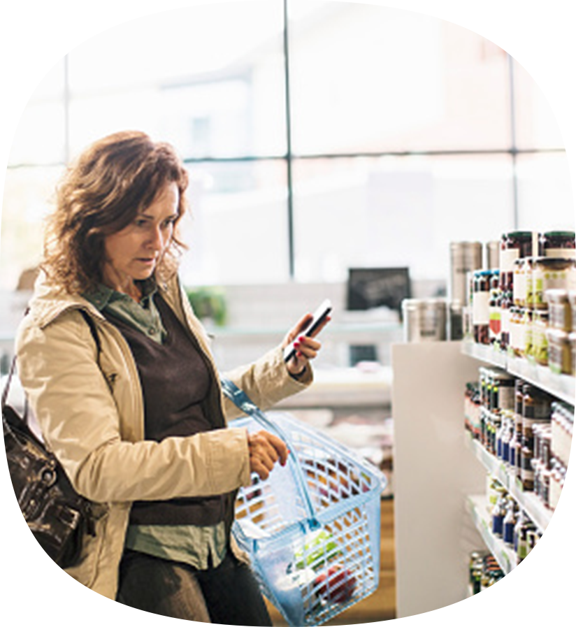 A person shopping for their CPG at a grocery store.