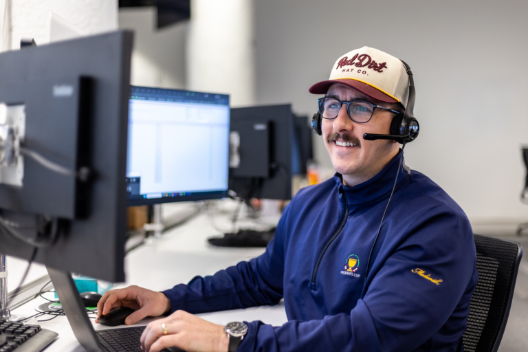 An Echo team member at their work station helping a client optimize their supply chain.