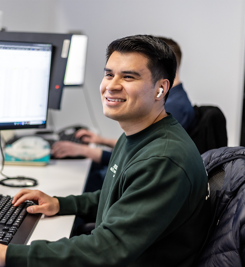 An Echo team member at their work station helping a client optimize their supply chain.