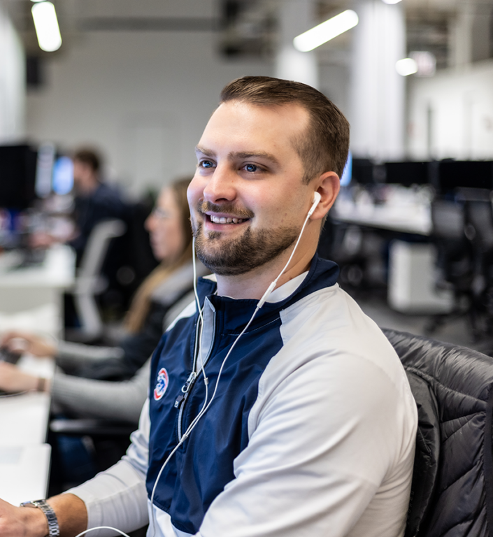 An Echo team member at their work station helping a client optimize their supply chain.