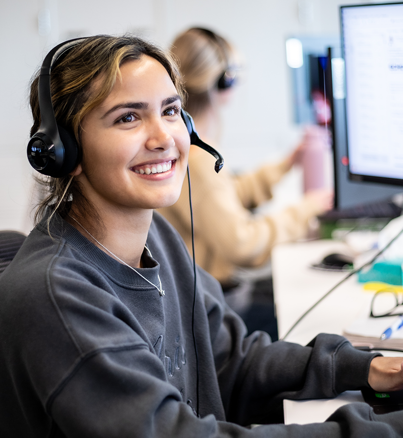 An Echo representative sitting at work station answering client calls.